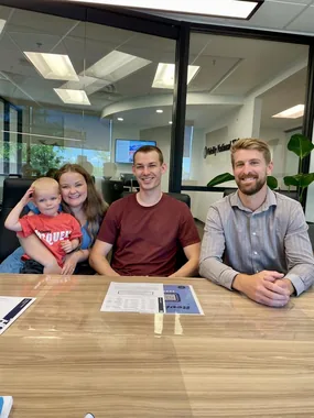 Jason with a client family at closing